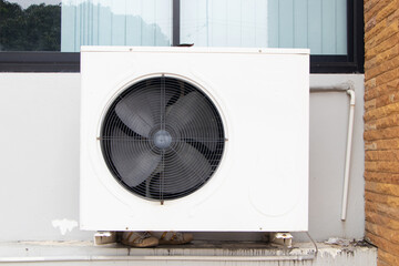 Air old conditioner compressor source heat pumps on the wall outdoor on the roof top of building for cooling at industrial plant. Cooling pump technology for home or office. Suitable for hot weather.