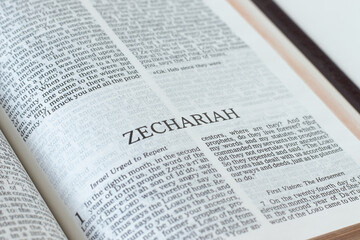 Zechariah open Holy Bible Book close-up. Old Testament Scripture prophecy. Studying the Word of God Jesus Christ. Christian biblical concept of faith, hope, and trust.