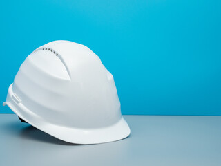 White construction helmet and construction tools.