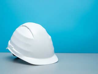 White construction helmet and construction tools.