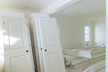 Interior wooden stacker door installation apartment building, wait installation for preparation of interior in new home