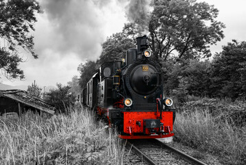 Historic steam train on a narrow gauge railway track in Sauerland Germany is a tourist attraction....