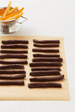 Chocolate-coated orange sticks