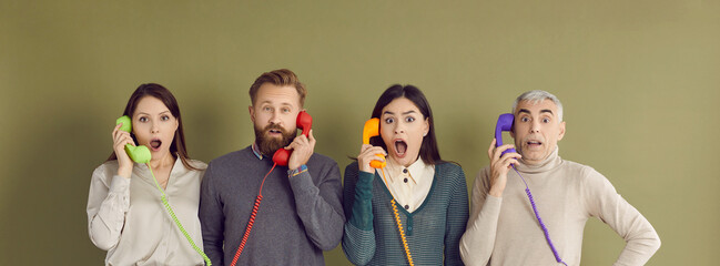 People get bad news over phone call. Four people of different ages and generations standing on green studio background and holding old retro telephone receivers with surprised shocked face expressions - obrazy, fototapety, plakaty