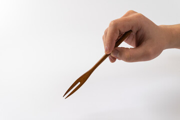 wooden fork on a white background