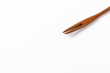wooden fork on a white background