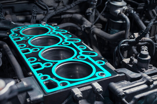 Short block with installed cylinder head gasket. Repair of a turbocharged diesel engine in a car workshop. Close up. Blur effect.