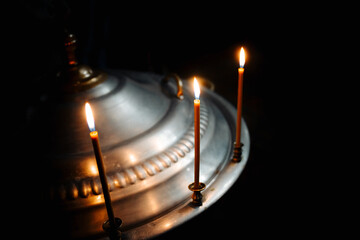 The sacrament of baptism. Three candles
