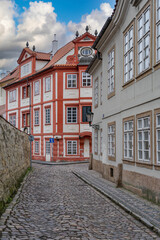 Old narrow street with stone road and lanterns in Visby, Sweden