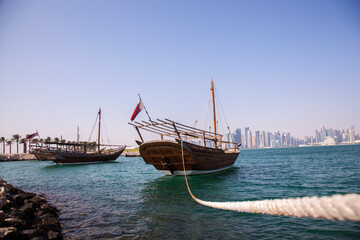 
Doha,Qatar- December 23,2018 :  Traditional dhow boats with the futuristic skyline of Doha in the background.