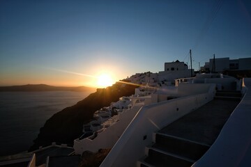 Rays of light just before the sun is setting at the famous village of Firostefani Santorini