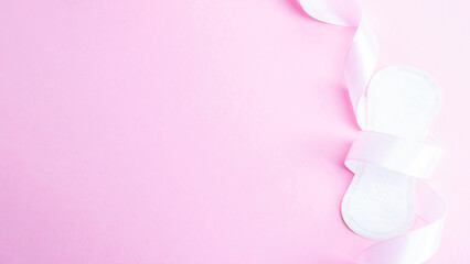 Obraz na płótnie Canvas Feminine hygiene menstrual pads. Menstruation napkin for woman hygiene on pink background. Menstruation feminine period. Menstruation, critical days, zero waste, eco, ecology banner.