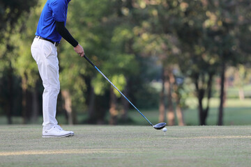 Young male golfer player on golf course