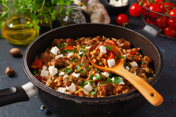 Traditional Greek cuisine. Lamb stew with feta cheese and vegetables.