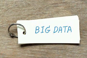 Flash card with handwriting word big data on wood background
