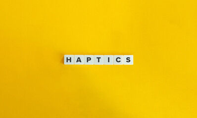 Haptics Word on Letter Tiles on Yellow Background. Minimal Aesthetics.