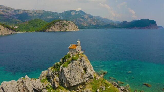Around on Sveta Nedelja church on sean rocky island near Petrovac, Montenegro.
