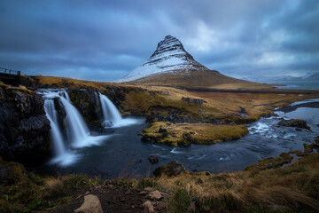 View of the Kirkjufell mountain and the Kirjufellsfoss waterfalls in Grundarfjordur in the Snaefelsness Peninsula, Iceland
