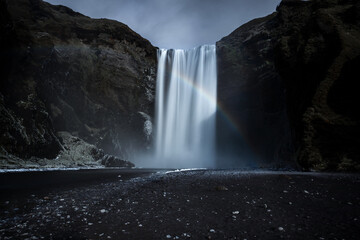 The majestic Skogafoss waterfall and a rainbow in Iceland © Giulio
