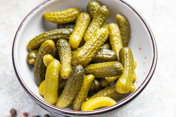 gherkins salted cucumbers pickled vegetables in a bowl fresh portion healthy meal food diet snack on the table copy space food background keto or paleo diet veggie vegan or vegetarian food