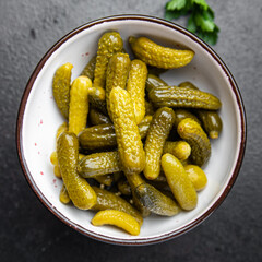 gherkins salted cucumbers pickled vegetables in a bowl fresh portion healthy meal food diet snack on the table copy space food background keto or paleo diet veggie vegan or vegetarian food