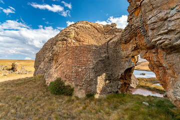 Travel to Lesotho. Natural arch created by erosion in Sehlabathebe National Park - obrazy, fototapety, plakaty