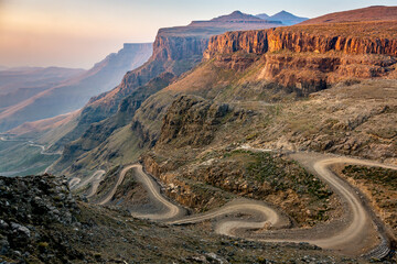 Travel to Lesotho. The winding Sani Pass dirt road between South Africa and Lesotho - 489006556