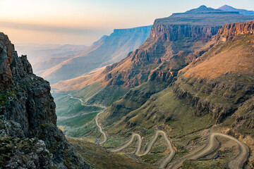 Travel to Lesotho. The winding Sani Pass dirt road between South Africa and Lesotho - 489006558