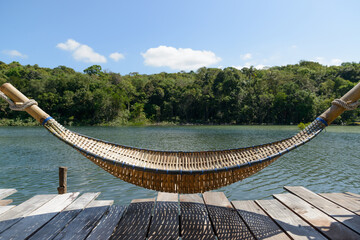 The hammock bed is made of woven bamboo.