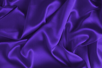 Purple silk or satin luxury fabric texture can use as abstract background.