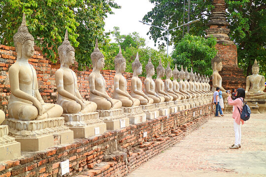 Row of Buddha Images Around the Inner Wall of Wat Yai Chai Mongkhon Ancient Temple, Ayutthaya Historical Park, Thailand