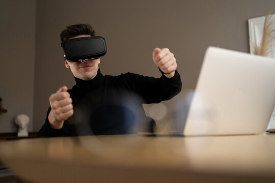 car with glasses virtual reality for work, uses a laptop computer in the office company report - Powered by Adobe