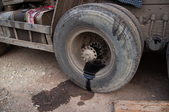 Wheel Hub Oil Leak. Wheel Repair On A Truck On The Road. Broken Car