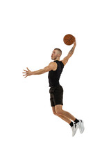 Flying. Portrait of basketball player jumping with ball isolated on white studio background. Sport, motion, activity concepts. Dunk, jam, stuff technic © master1305