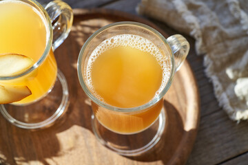 Hot pear drink on a wooden table