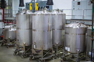 Stainless vertical steel tanks with equipment tank chemical cellar at the with scrolling wheel stainless steel tanks cleaning and mixing at control room