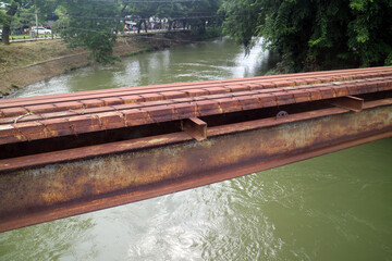 rusty aqueduct bridge over the river close up