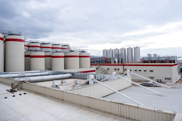 Obraz premium Fermentation tanks for making different types of beer in the Distillery.Giant stainless steel fermentation for industrial use.