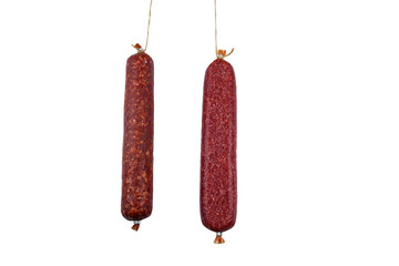 Two hanging raw smoked sausage isolated on white background