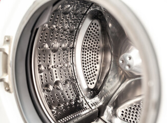 Drum of washing machine dry and clean close-up. Washing Dryer Machine inside view of a drum.