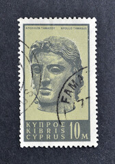 Cancelled postage stamp printed by Cyprus, that shows Head of Apollo of Tamasos, circa 1962.
