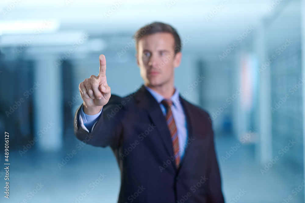 Poster corporate tools at one simple touch. cropped shot of a handsome young business professional using a 