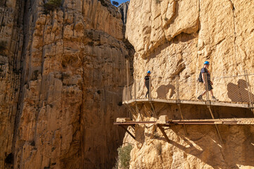 tourists enjoy hiking the Camino del Rey on a bautiful winter day