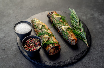 Baked mackerel on a stone background