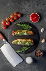 Baked mackerel on a stone background