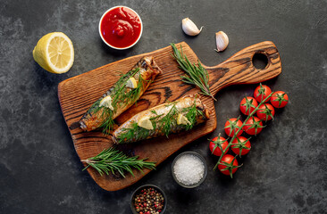 Baked mackerel on a stone background