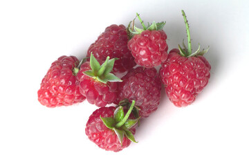 Ripe garden raspberries isolated on a white background.