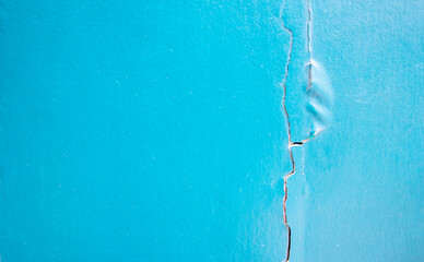 Pastel blue decorative wall pattern with cracks