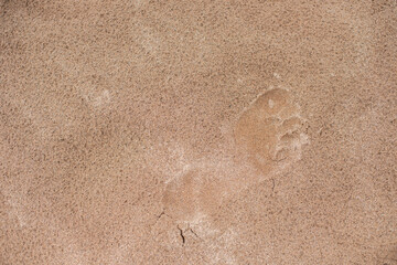 human footprints on the sand