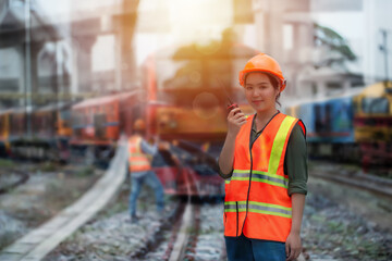 worker on the station. double exposure  woman worker using radio communication on locomotive background.